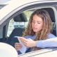 young woman reading penalty receipt in car drivers seat photo 1